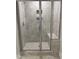 Modern tiled shower with seamless glass enclosure and a built-in bench at 3500 Bailey Lake Dr, Fuquay Varina, NC 27526