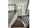 Grand two-story foyer with hardwood staircase and railing, and a view of the bright entry with transom window at 3500 Bailey Lake Dr, Fuquay Varina, NC 27526