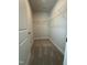Spacious walk-in closet offering ample storage with installed shelving and neutral carpeting at 3500 Bailey Lake Dr, Fuquay Varina, NC 27526