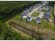 Aerial view of a new residential neighborhood with a pond and green spaces at 359 Abbot Pl, Chapel Hill, NC 27516