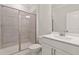 Clean bathroom with a tiled shower, white vanity, and modern fixtures at 359 Abbot Pl, Chapel Hill, NC 27516