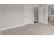 Cozy bedroom with neutral tones and entry to bathroom at 359 Abbot Pl, Chapel Hill, NC 27516