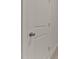 Interior door with a round brushed-nickel handle and simple paneled design at 359 Abbot Pl, Chapel Hill, NC 27516