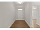 Bright foyer with hardwood floors, white trim, and a view of the front door at 359 Abbot Pl, Chapel Hill, NC 27516