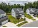 Aerial view showcasing home's front elevation, well-manicured lawn, and attached two car garage at 359 Abbot Pl, Chapel Hill, NC 27516