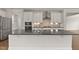 Modern kitchen with stainless steel appliances and a large island at 359 Abbot Pl, Chapel Hill, NC 27516