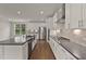 Gourmet kitchen boasts stainless steel appliances, ample counter space, and custom cabinetry at 359 Abbot Pl, Chapel Hill, NC 27516