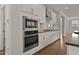 Kitchen with stainless steel appliances, sleek countertops, and ample storage space in stylish cabinetry at 359 Abbot Pl, Chapel Hill, NC 27516