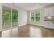 Bright living area featuring a sliding door to the porch, large windows, and modern finishes at 359 Abbot Pl, Chapel Hill, NC 27516