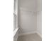 Empty walk-in closet with basic wire shelving and natural light at 359 Abbot Pl, Chapel Hill, NC 27516