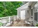 Charming balcony with white lattice railing and outdoor chairs providing a cozy outdoor retreat at 405 Gooseneck Dr # B6, Cary, NC 27513