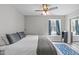 This bedroom includes a ceiling fan, a rug, and natural light from the window at 405 Gooseneck Dr # B6, Cary, NC 27513