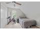 Charming bedroom with a large window, closet, and ceiling fan providing ample natural light at 405 Gooseneck Dr # B6, Cary, NC 27513
