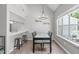 Dining area with vaulted ceiling, modern lighting, and breakfast bar at 405 Gooseneck Dr # B6, Cary, NC 27513