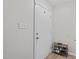 Entryway featuring light grey wall, dark laminate flooring, and shoe rack at 405 Gooseneck Dr # B6, Cary, NC 27513