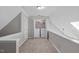 Hallway with a laundry room and a neutral colored carpet at 405 Gooseneck Dr # B6, Cary, NC 27513