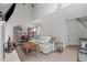 Living room featuring vaulted ceiling, modern decor and hardwood laminate floor at 405 Gooseneck Dr # B6, Cary, NC 27513