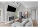 Spacious living room featuring fireplace, high ceiling, and modern decor at 405 Gooseneck Dr # B6, Cary, NC 27513