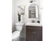 Bathroom featuring a vanity with a modern sink, toilet, and tiled shower at 407A Edward St, Durham, NC 27701