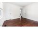 Bedroom with hardwood floors, white walls, and a closet at 407A Edward St, Durham, NC 27701