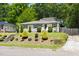 Charming home with well-maintained landscaping and a walkway leading to the front entrance at 407A Edward St, Durham, NC 27701