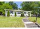 Beautiful home featuring a manicured lawn and inviting walkway leading to the front entrance at 407A Edward St, Durham, NC 27701