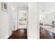 Bright hallway featuring hardwood floors and connecting living areas at 407A Edward St, Durham, NC 27701