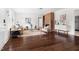 Bright living room with dark wood floors, a decorative fireplace, and modern furnishings at 407A Edward St, Durham, NC 27701