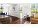 Bright living room featuring hardwood floors, an open entrance, and neutral walls at 407A Edward St, Durham, NC 27701