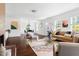 Spacious living room featuring a decorative fireplace, hardwood floors, and stylish furnishings at 407A Edward St, Durham, NC 27701
