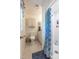 Bright bathroom with tiled shower, vanity with storage, and neutral decor at 4200 Marvin Pl, Raleigh, NC 27609
