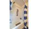 Well-lit bathroom featuring a tub with white tile surround and built-in shelving at 4200 Marvin Pl, Raleigh, NC 27609