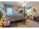Cozy bedroom with natural light, ceiling fan, and a four-poster bed at 4200 Marvin Pl, Raleigh, NC 27609