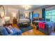Spacious bedroom featuring a four-poster bed, work space, and comfortable sitting area at 4200 Marvin Pl, Raleigh, NC 27609