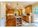 Bright kitchen with a center island, stainless steel appliances, and ample counter space at 4200 Marvin Pl, Raleigh, NC 27609