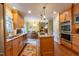 Open kitchen with stainless appliances that flows into the dining area at 4200 Marvin Pl, Raleigh, NC 27609