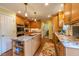 Spacious kitchen featuring stainless steel appliances and a functional center island at 4200 Marvin Pl, Raleigh, NC 27609
