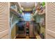 Practical laundry room with shelving and modern washer and dryer units at 4200 Marvin Pl, Raleigh, NC 27609