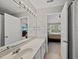 Bathroom featuring a large mirror over a white vanity and doorway views into other rooms at 4353 Sugarbend Way, Raleigh, NC 27606
