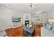 Comfortable living room featuring a cozy fireplace, hardwood floors, and an open layout at 4353 Sugarbend Way, Raleigh, NC 27606