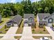 Aerial view of homes showcasing manicured lawns, driveways, and neighborhood layout at 445 Sturgeon St, Smithfield, NC 27577