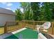 Relaxing back deck with classic white wicker seating and a view of the yard at 445 Sturgeon St, Smithfield, NC 27577