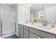 Bathroom features a double sink vanity, a large mirror, and walk-in shower at 445 Sturgeon St, Smithfield, NC 27577