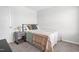 Cozy bedroom with neutral carpet and decor, including a single bed and nightstand at 445 Sturgeon St, Smithfield, NC 27577