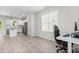 Open floorplan with kitchen with a granite-topped island leading into the living area, creating a connected space at 445 Sturgeon St, Smithfield, NC 27577