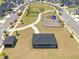 Aerial view of the neighborhood featuring a playground, walking paths, and community spaces at 445 Sturgeon St, Smithfield, NC 27577