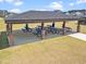 Community picnic shelter with multiple tables and seating, perfect for outdoor gatherings and events at 445 Sturgeon St, Smithfield, NC 27577