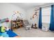 Playful room featuring toys, a rocking chair, a comfortable playmat, and lots of wall art at 445 Sturgeon St, Smithfield, NC 27577