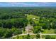 Scenic aerial view of property nestled among lush greenery and beautiful landscapes at 4720 Cedarfield Dr, Raleigh, NC 27606