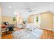 Bedroom with a white ceiling fan, and cream-colored walls, featuring a piano at 4720 Cedarfield Dr, Raleigh, NC 27606